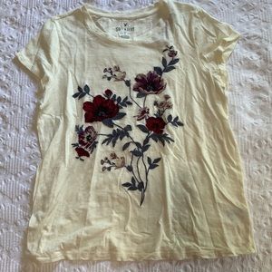 cream t-shirt with purple flowers